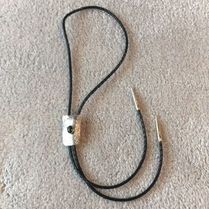 Women’s black leather and silver bolo tie